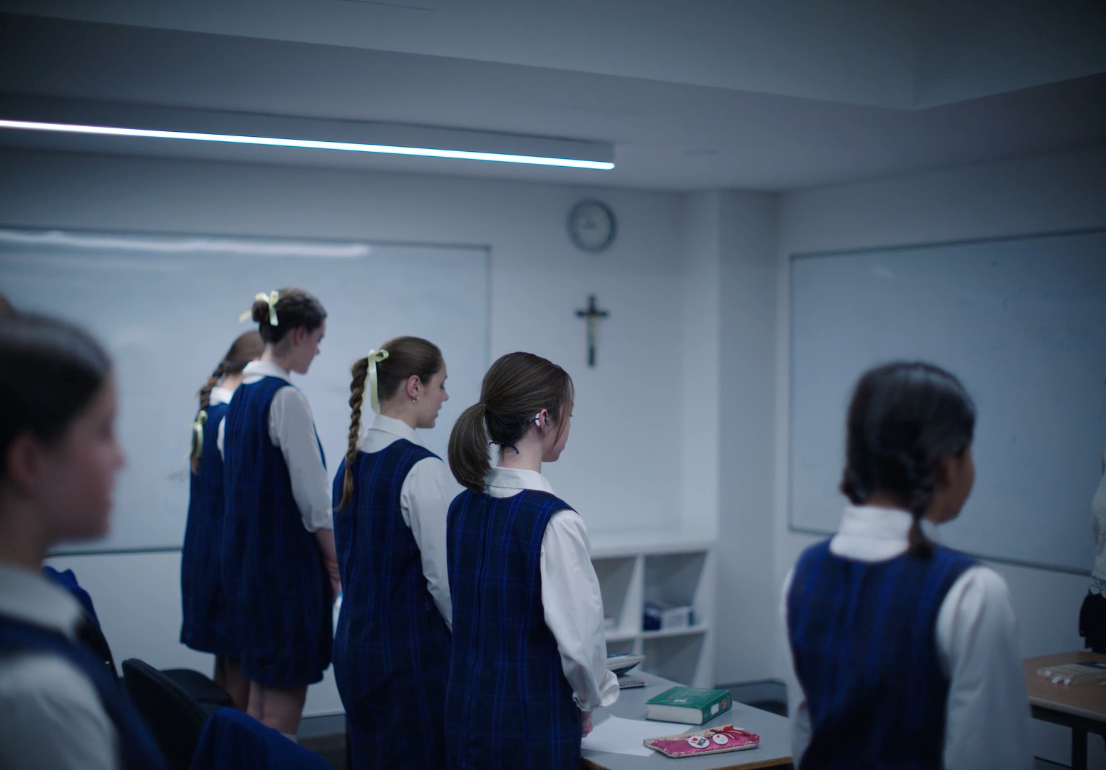 a group of young girls standing in front of a whiteboard