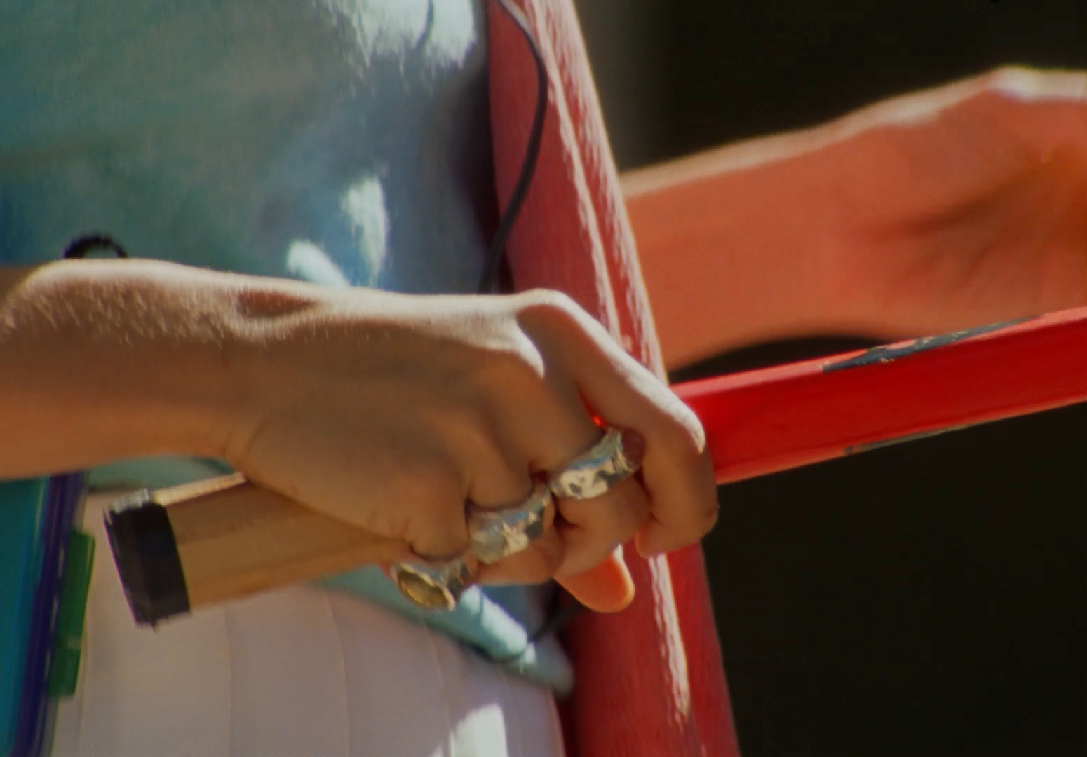 a close up of a person holding a baseball bat