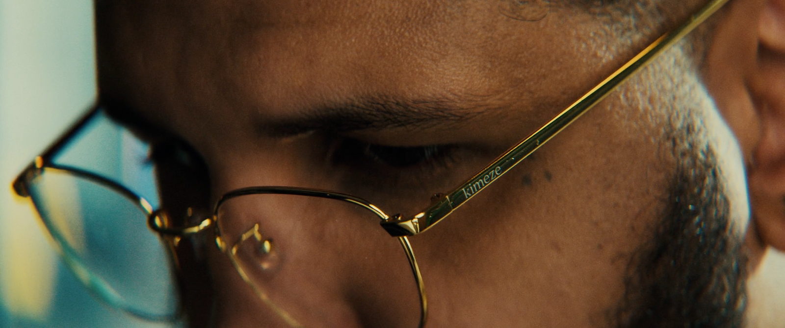 a close up of a man wearing glasses