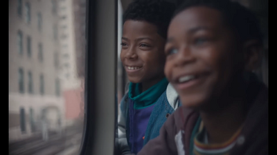 a couple of people that are looking out of a window