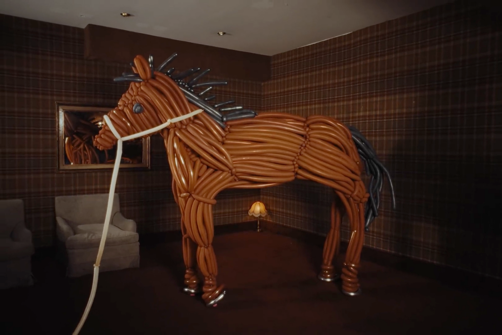 a horse made out of wires in a room