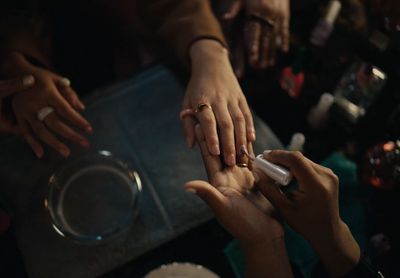 a group of people putting their hands together