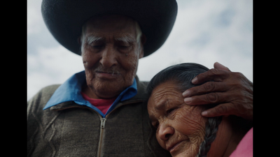 a man and woman with a hat on their heads