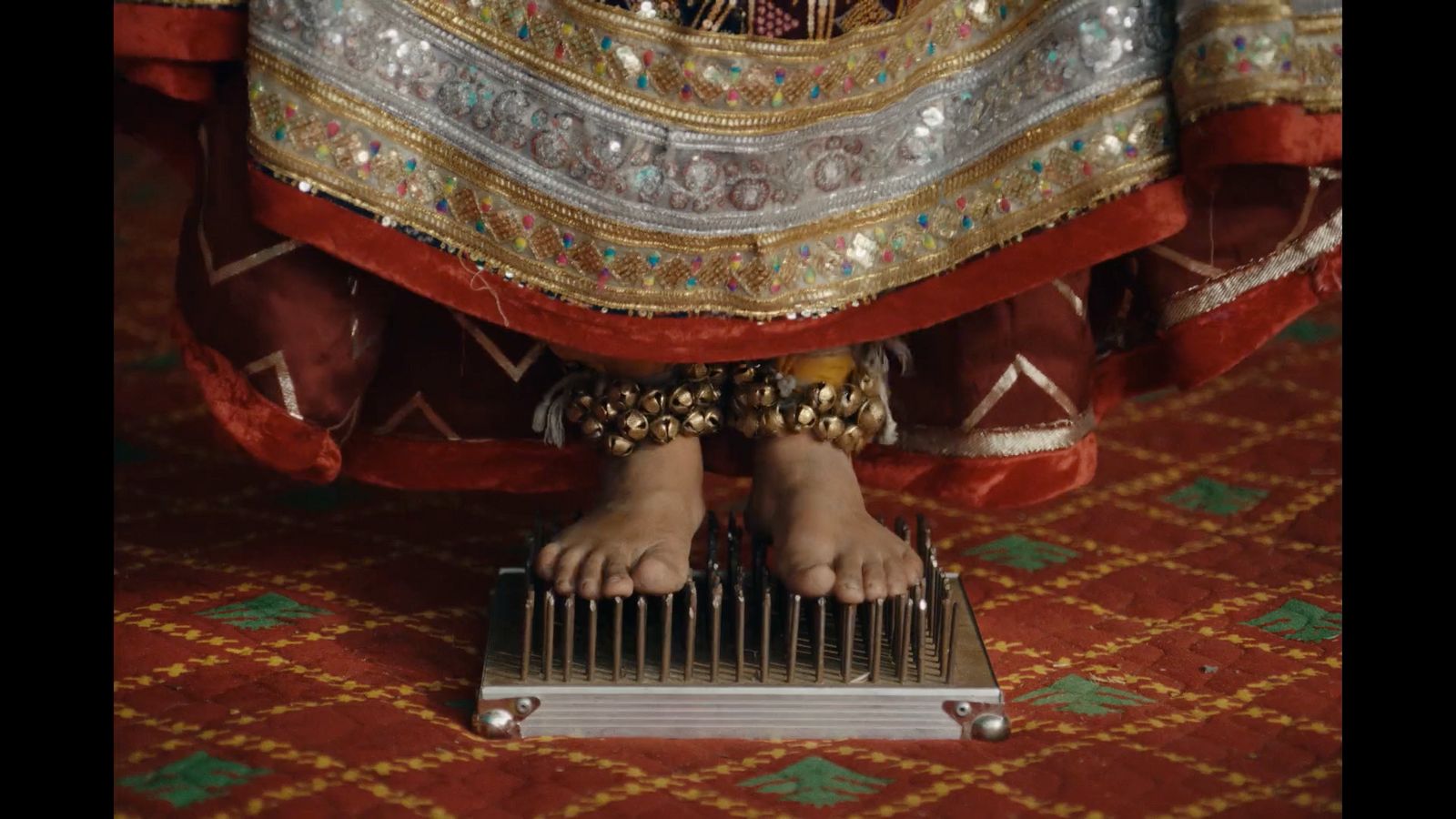 a close up of a person's feet on a musical instrument