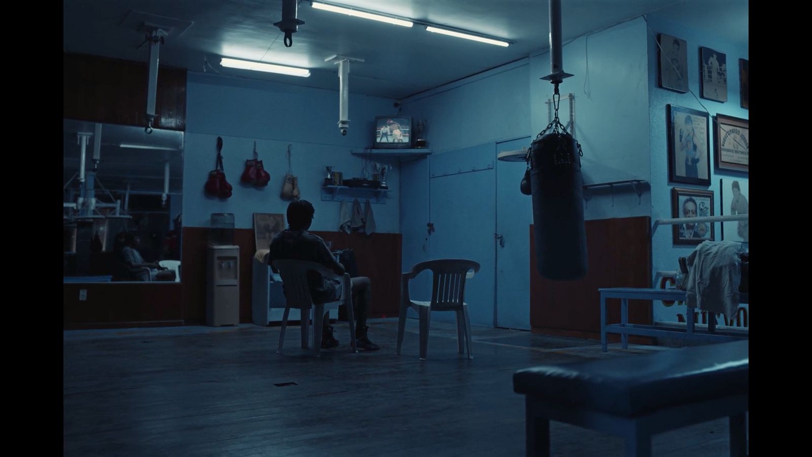 a man sitting in a chair in a room