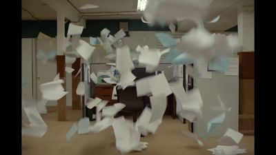 a room filled with lots of papers flying through the air