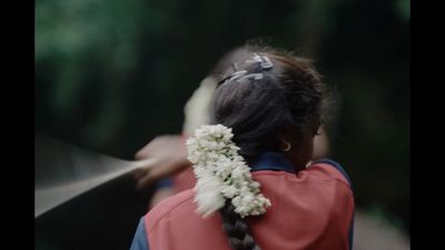 a woman with a flower in her hair