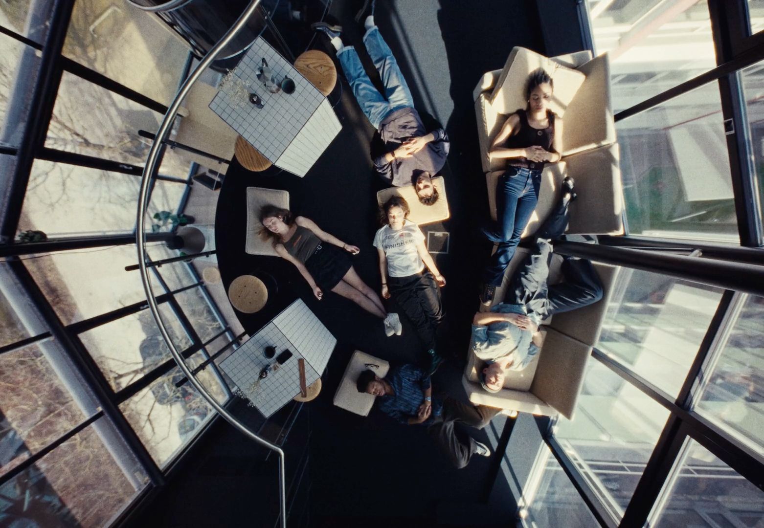 a group of people sitting around a table in a room