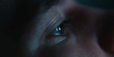 a close up of a person's eye in the dark