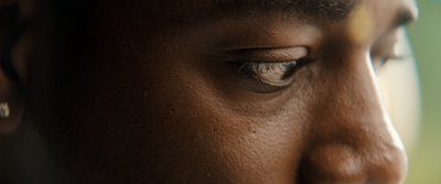 a close up of a person's eye with a blurry background