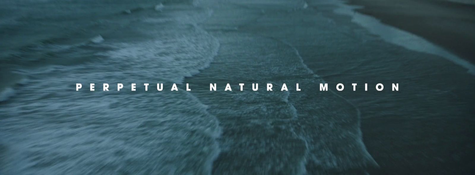 a photo of the ocean with the words,'perpetual natural motion '