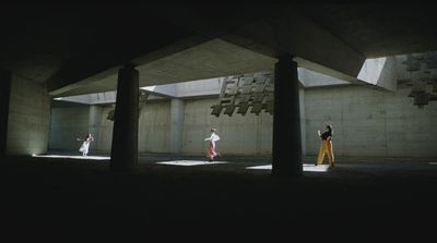 a group of people standing under a bridge