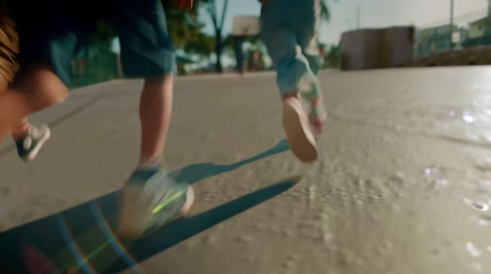 a person riding a skateboard down a street