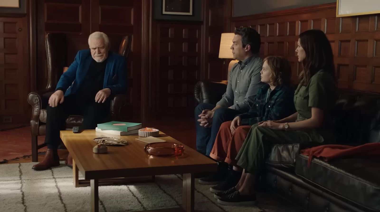 a group of people sitting around a coffee table