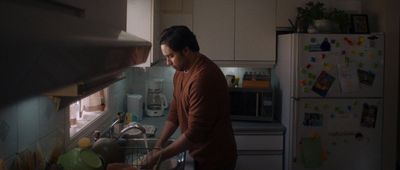 a man standing in a kitchen preparing food