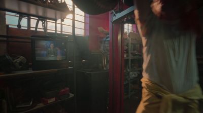 a man standing in front of a tv in a room