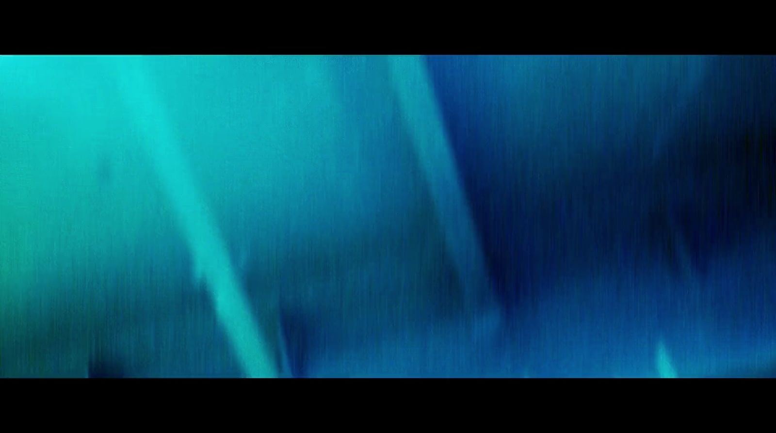 a blurry image of a blue and green background