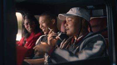 a group of people sitting next to each other on a bus