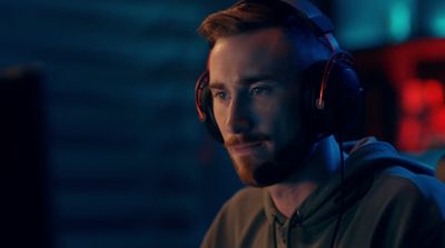 a man wearing headphones in a dark room