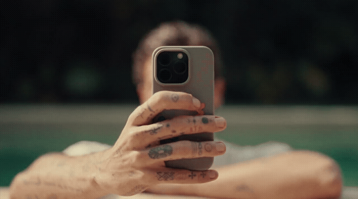 a man taking a picture with his cell phone