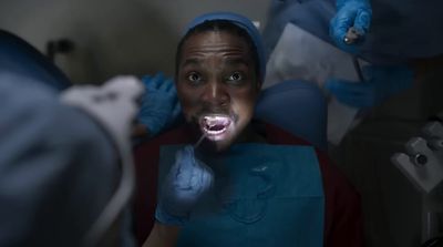 a woman with a toothbrush in her mouth