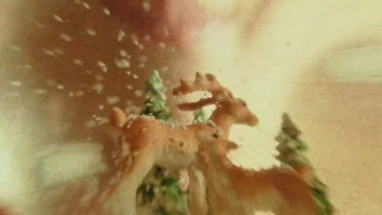 a blurry photo of deer in a forest