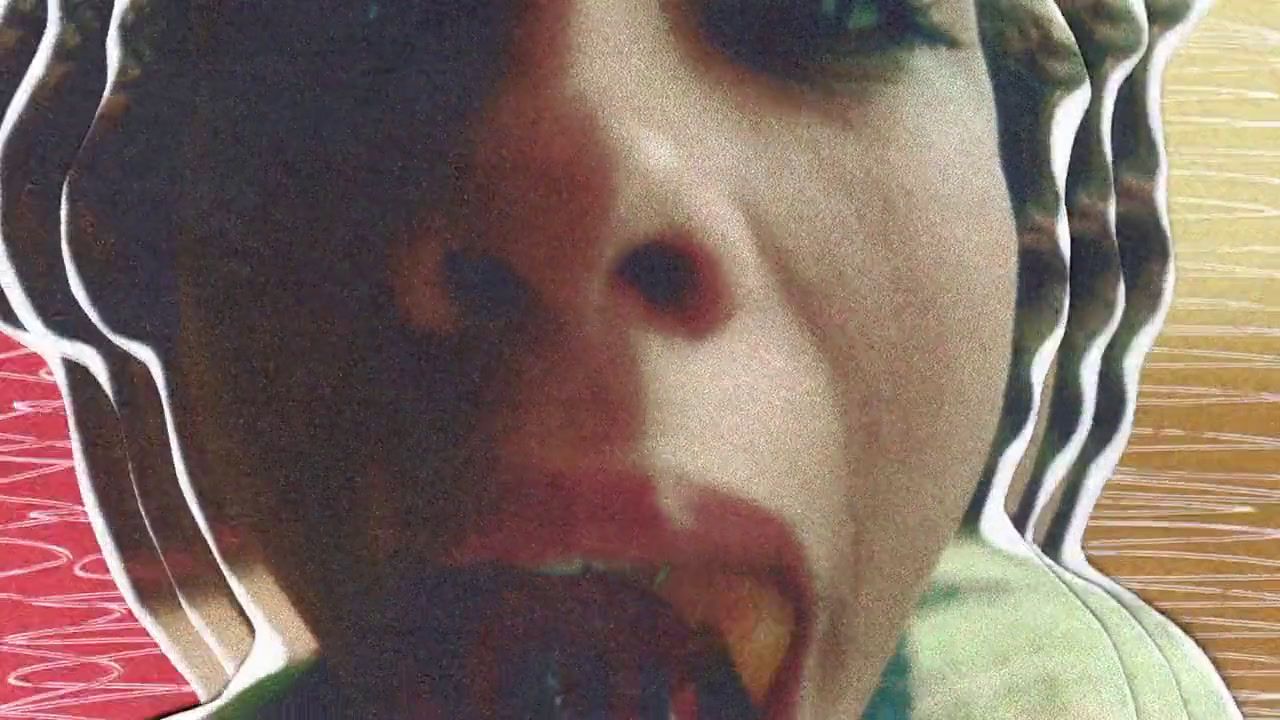 a close up of a person with food in their mouth