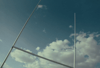 a soccer goal post with a blue sky in the background