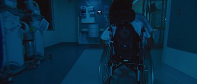 a person in a wheel chair in a room