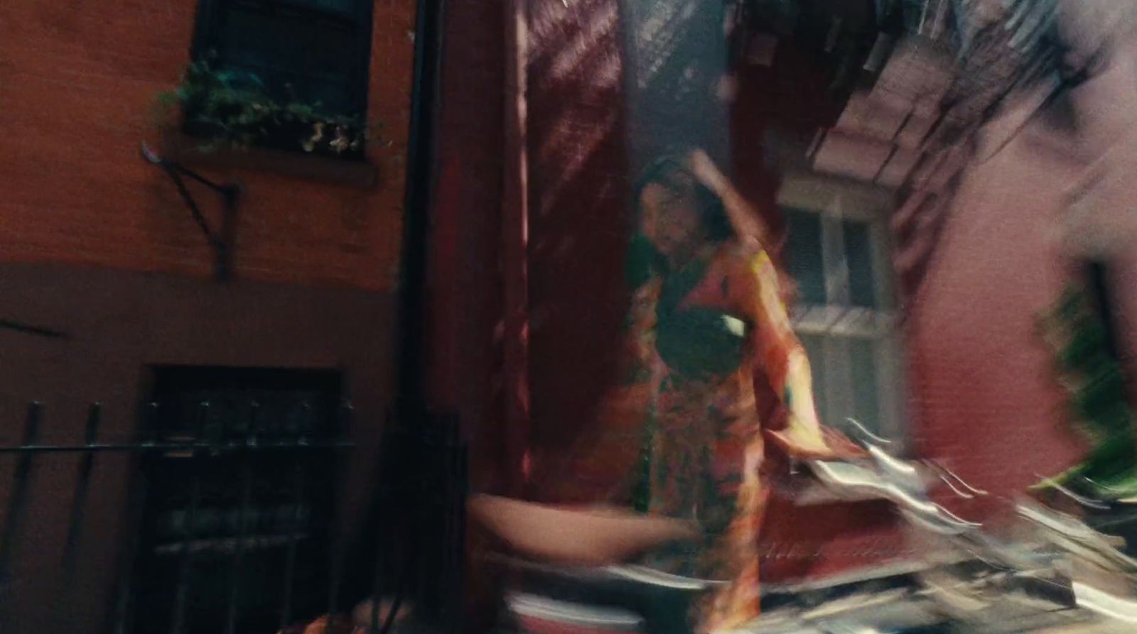 a blurry photo of a woman walking down a street