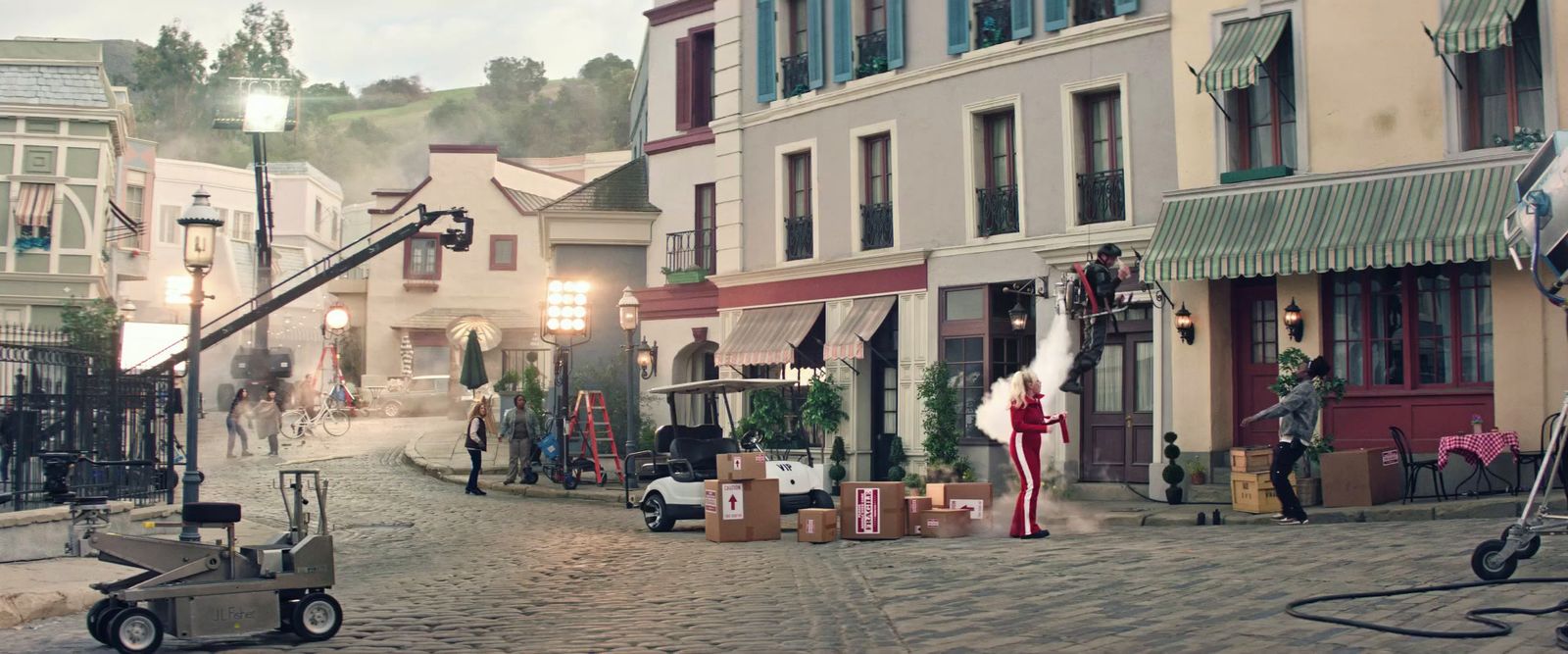 a street scene with a camera set up in front of a building