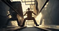 a person is standing on an escalator in a building