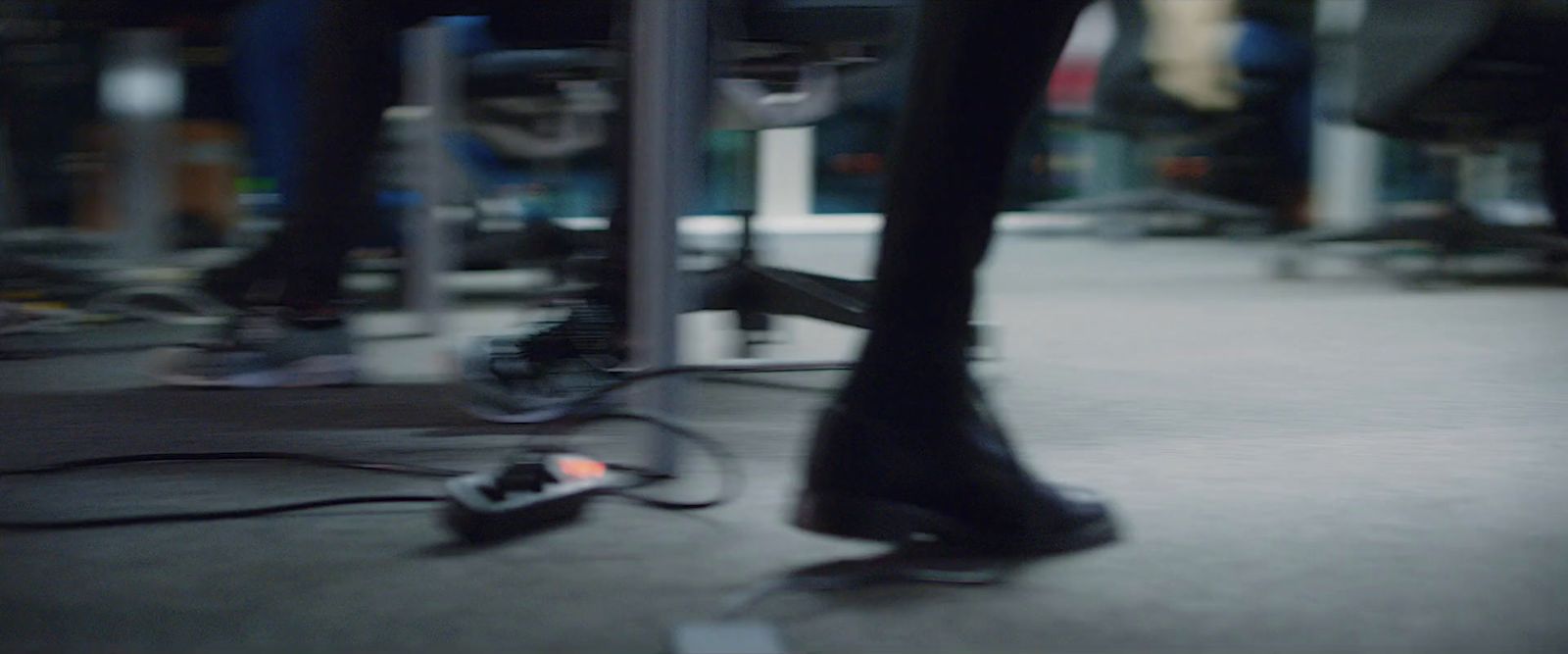 a pair of black shoes sitting on top of a floor