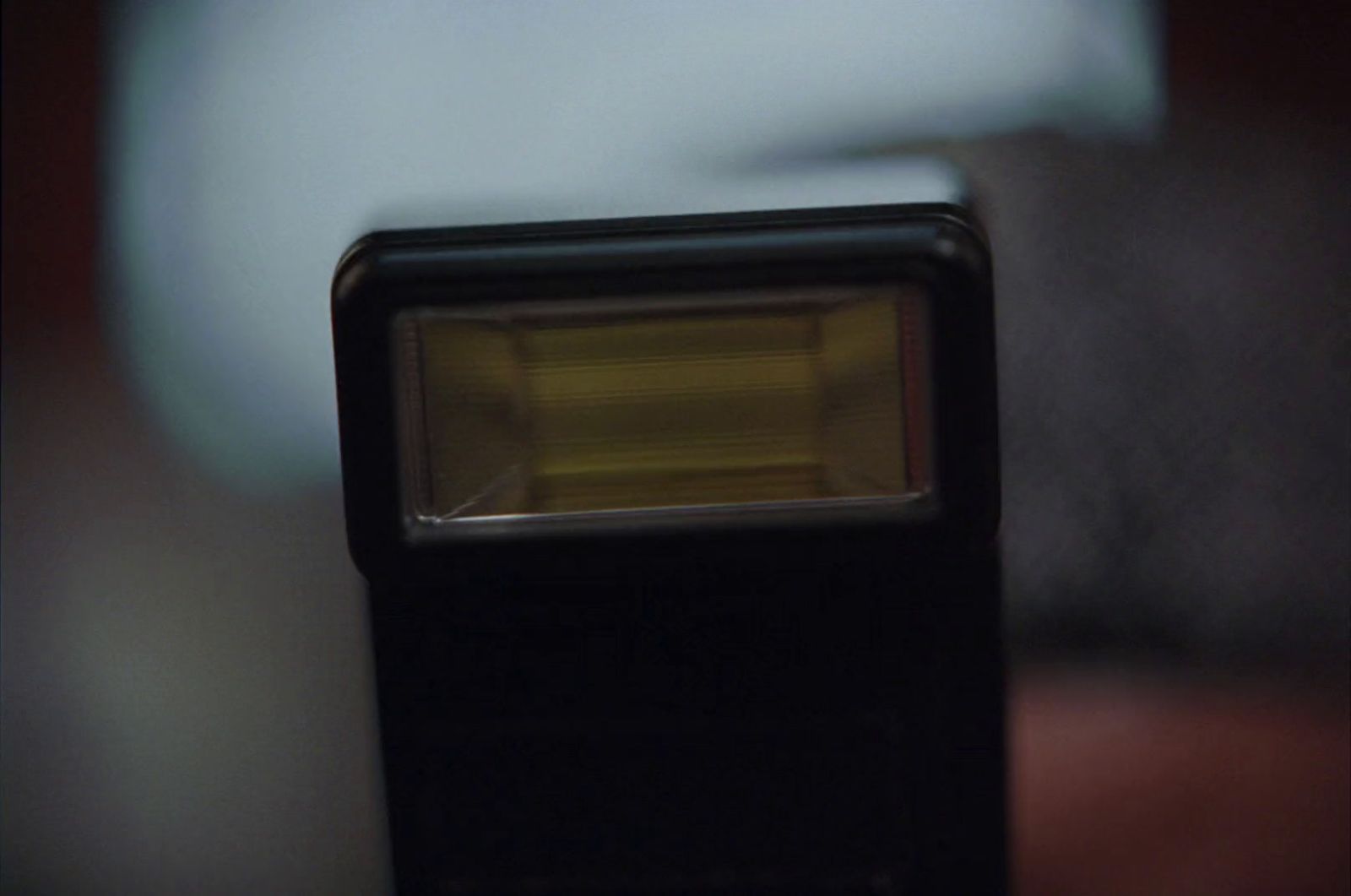 a close up of a camera with a light shining on it