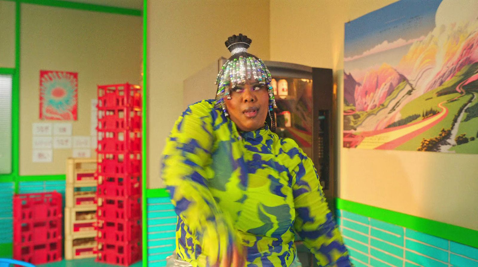 a woman standing in a room with a frisbee in her hand