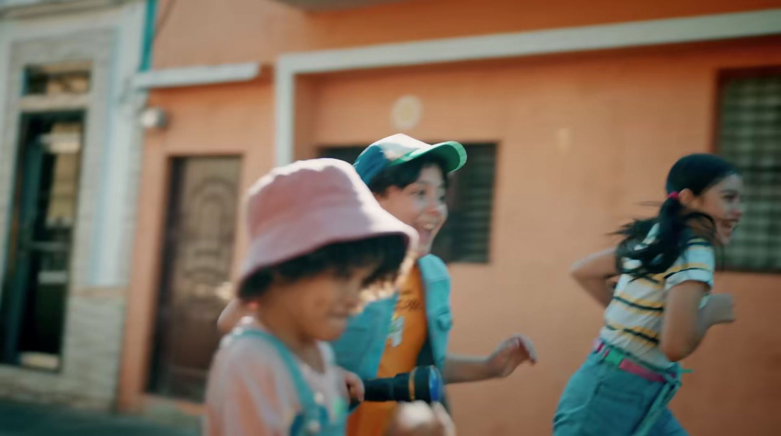 a group of young people walking down a street