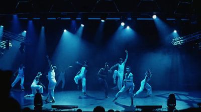 a group of people standing on top of a stage