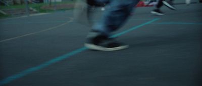 a person riding a skateboard down a street