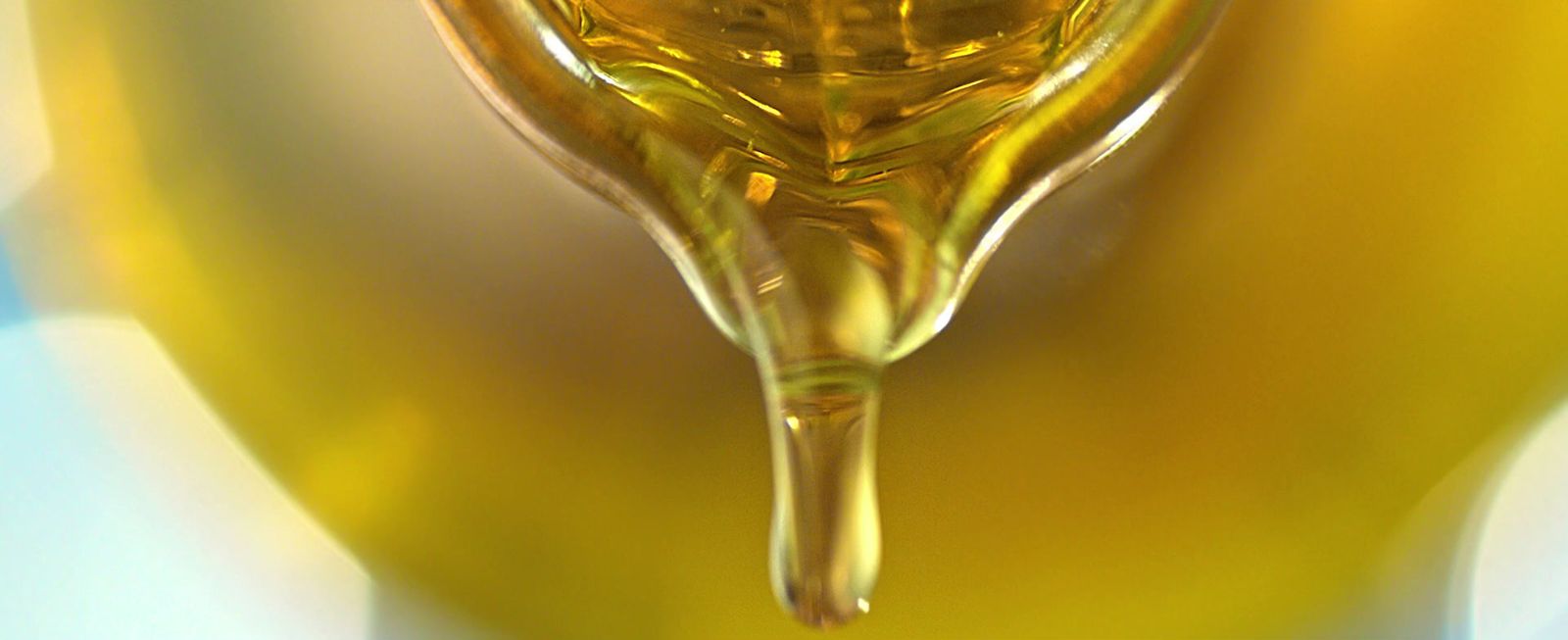 a drop of olive oil on a spoon