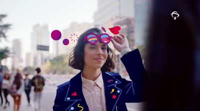 a woman is looking through a pair of glasses