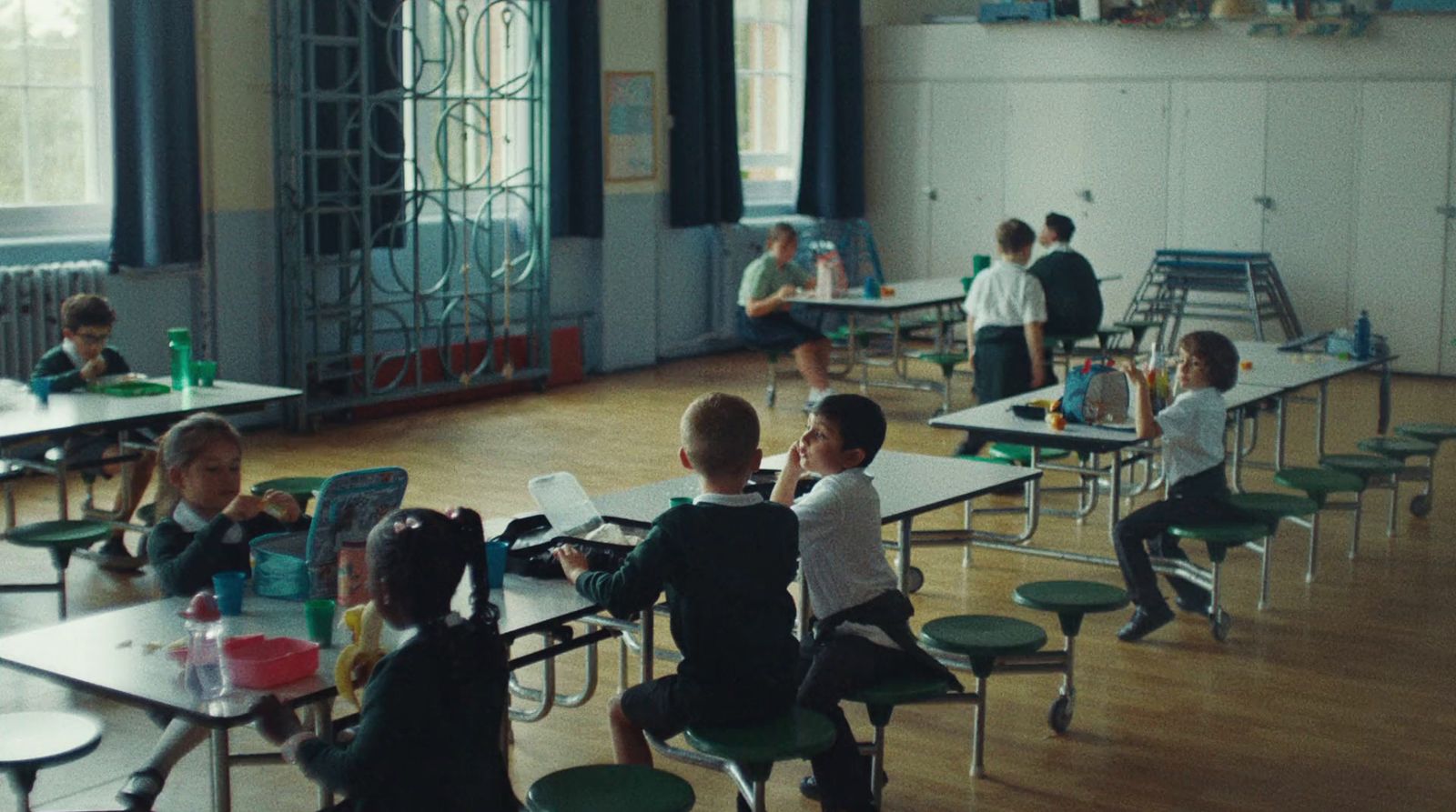 a group of children sitting at desks in a classroom