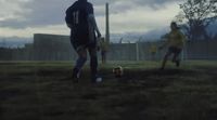 a group of young men playing a game of soccer