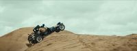 a car is stuck in the sand on top of a hill