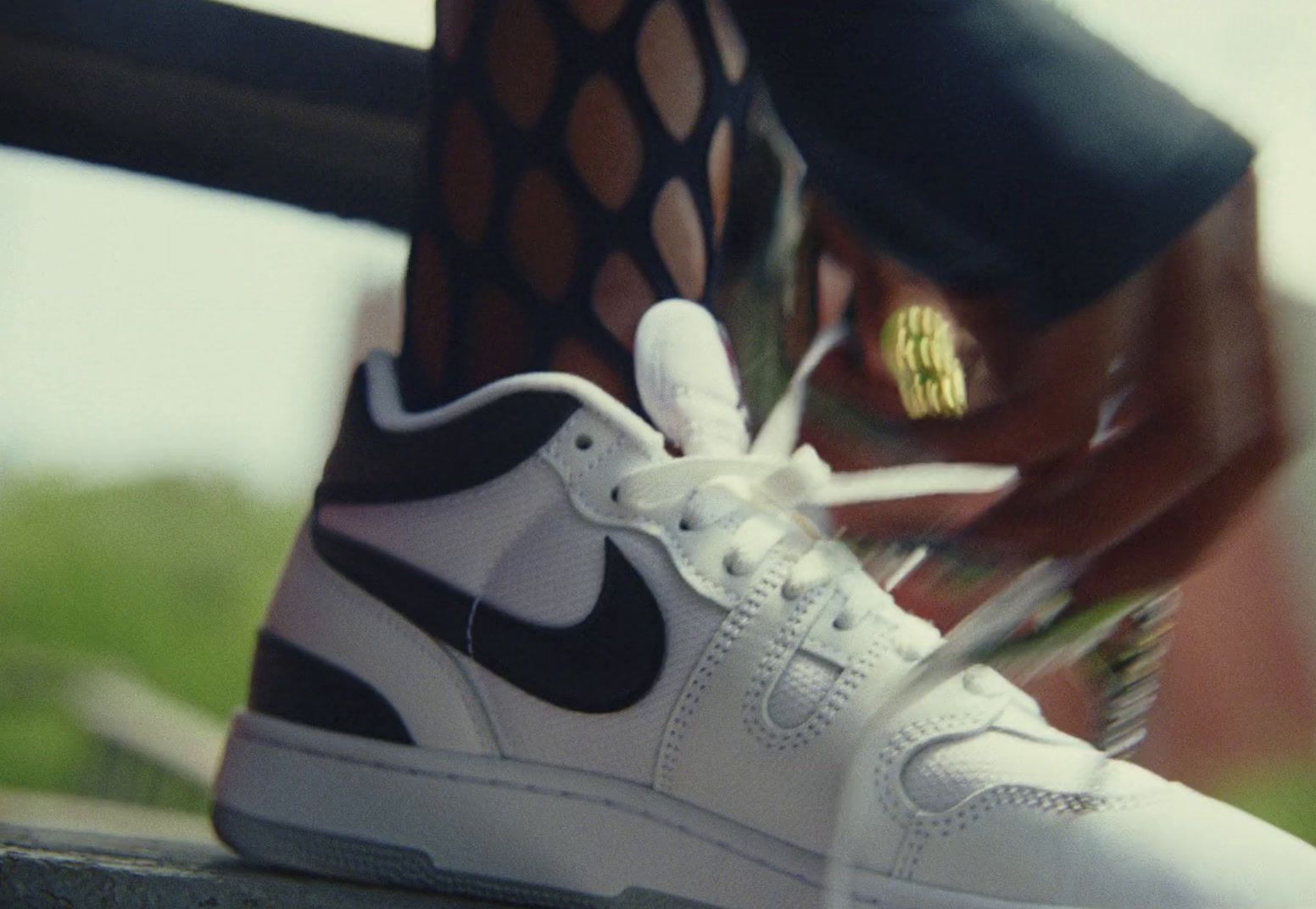 a close up of a person's shoes with a shoelace