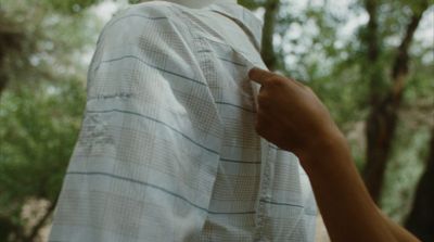 a person wearing a white shirt and a white hat