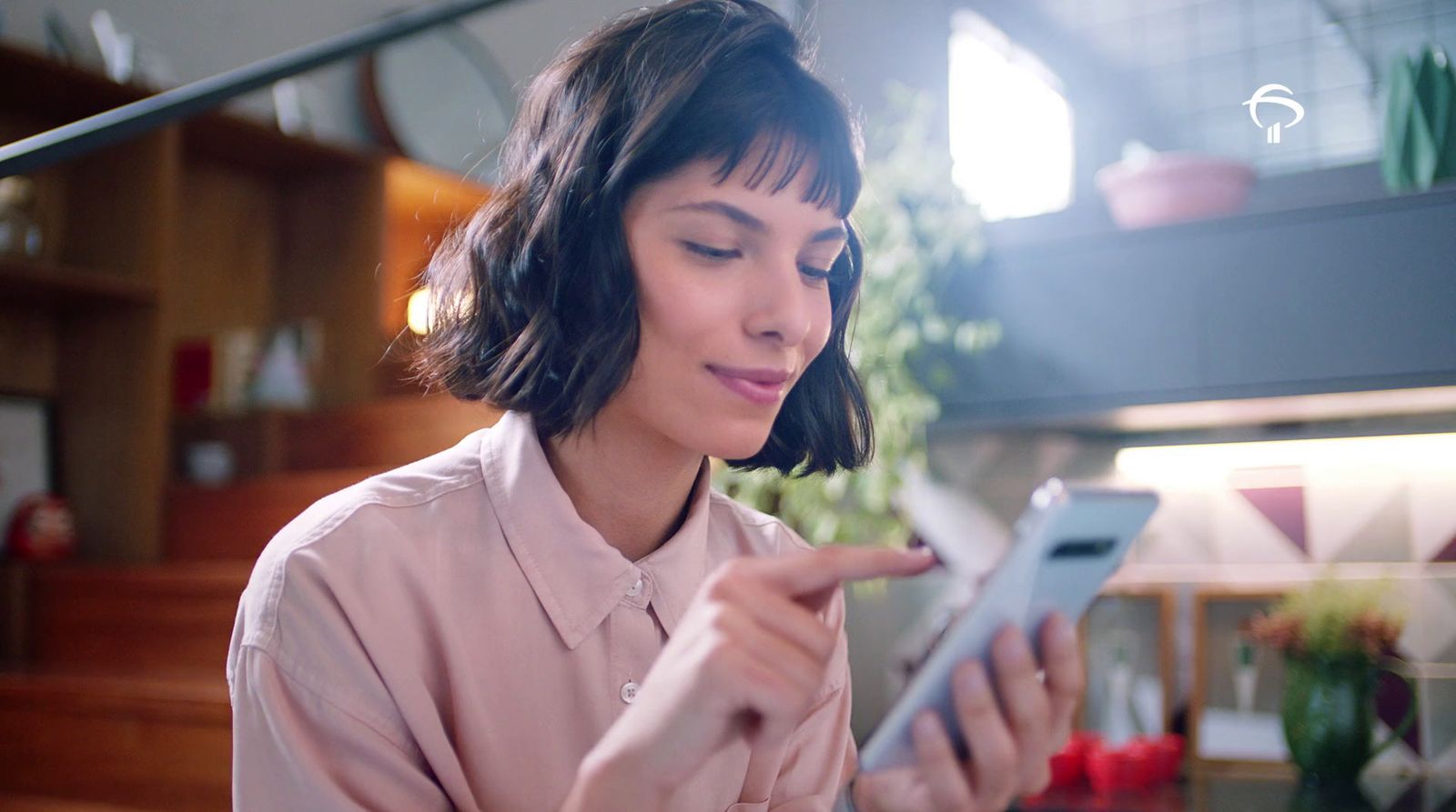 a woman is looking at her cell phone