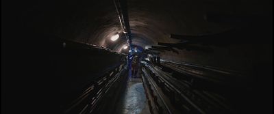 a train traveling through a tunnel filled with people