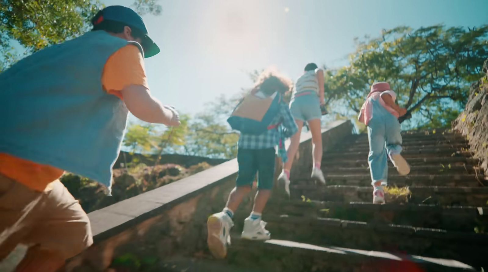 a group of people walking up a flight of stairs