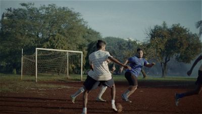 a group of people playing a game of soccer