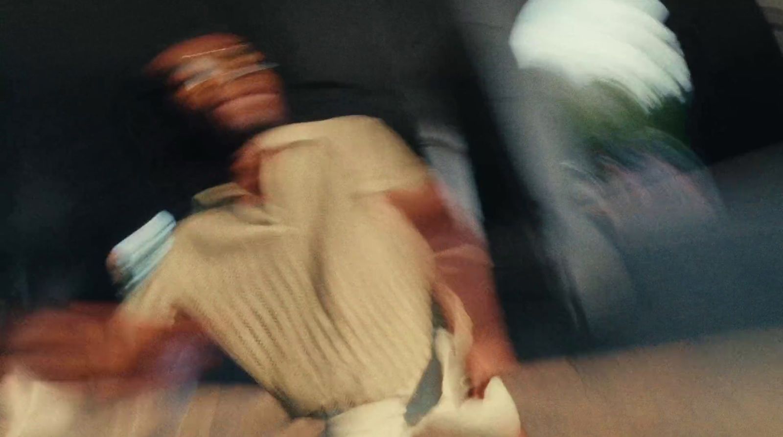 a blurry photo of a man riding a skateboard